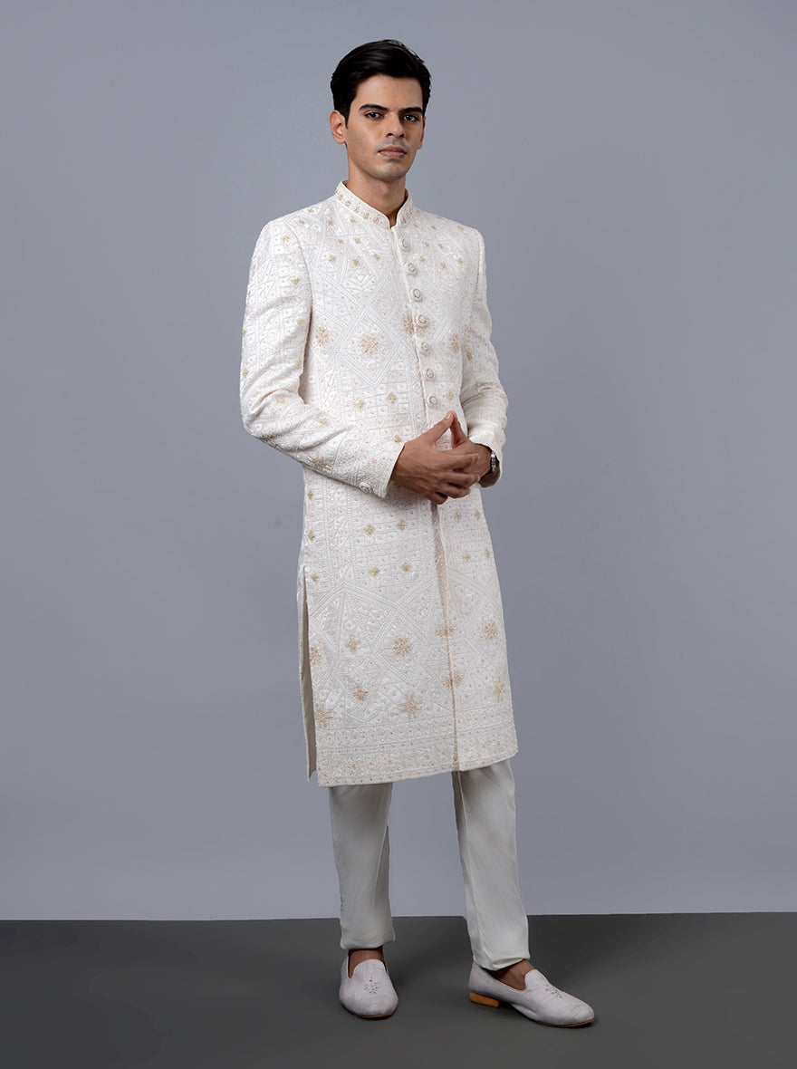 Elegant off-white sherwani featuring a regular fit and intricate embroidery, perfect for weddings.