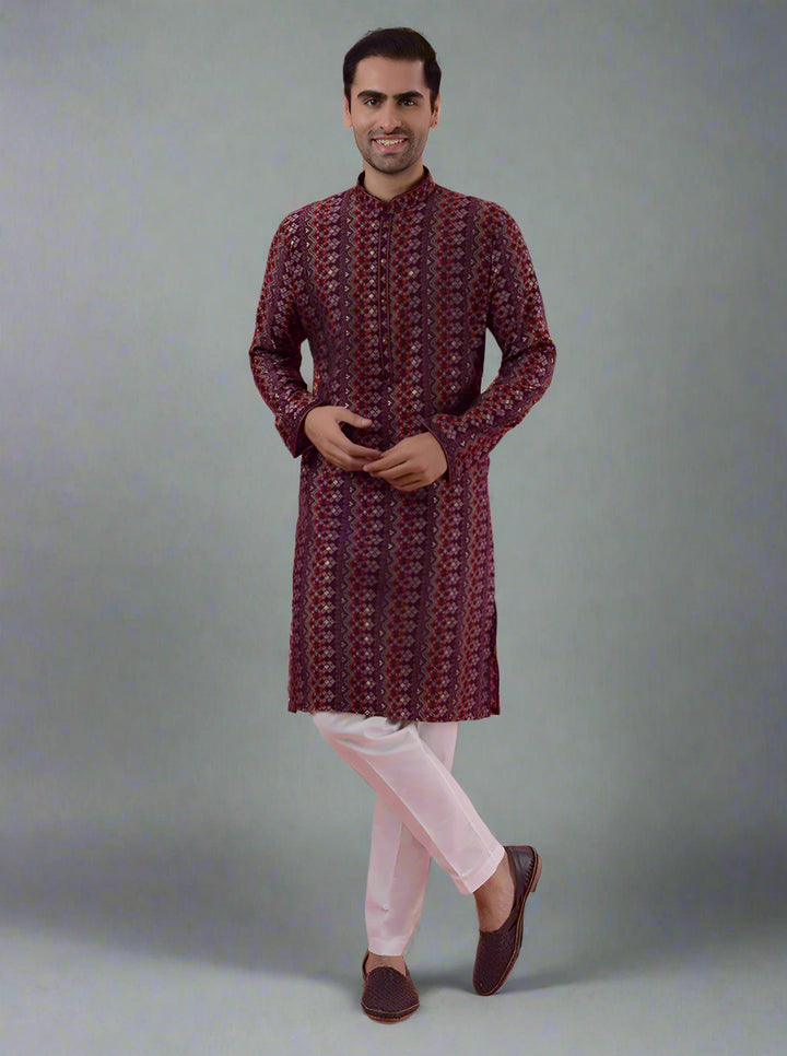 Maroon silk kurta pajama set for men, perfect for cultural events and special occasions.