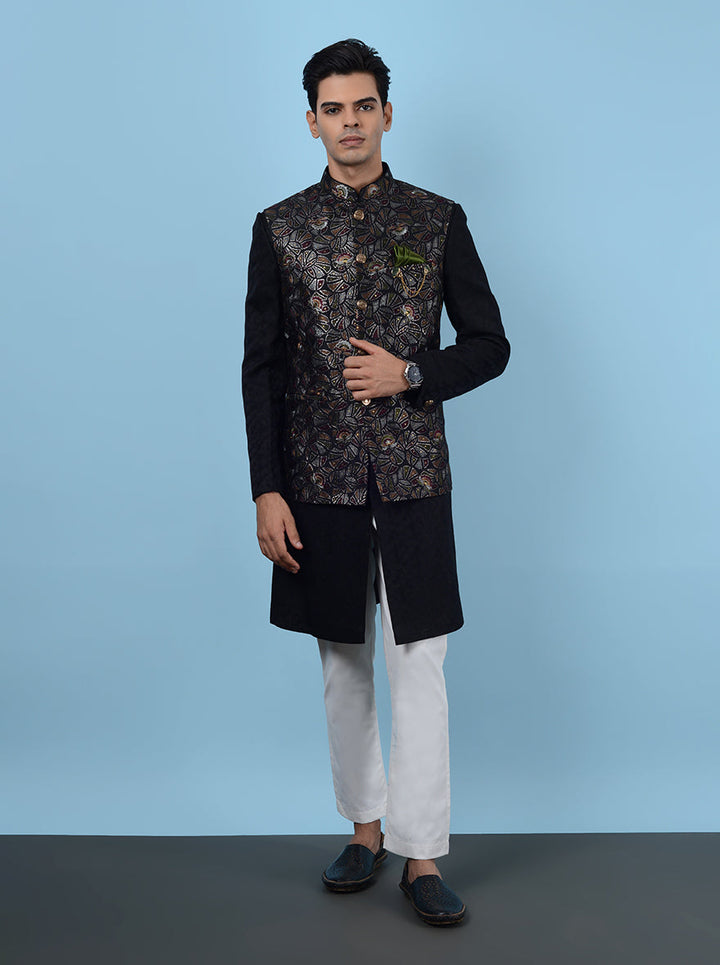 Elevate your sangeet look with this sophisticated Indowestern, made from premium silk blend and adorned with exquisite embroidery, ensuring you stand out at celebrations in the USA.