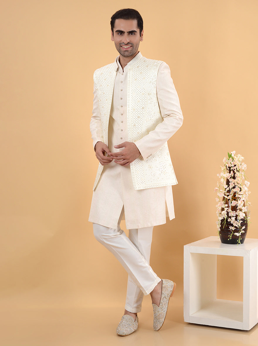 Experience luxury with our cream Indo Western attire, featuring exquisite embroidery for special occasions.