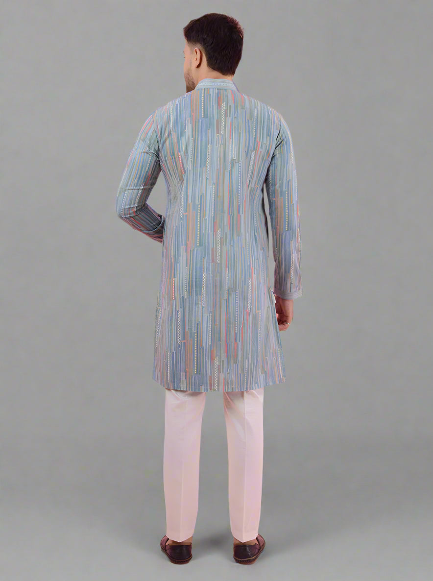 Sky blue kurta pajama set for men, featuring a multi-printed pattern, ideal for ethnic wear.