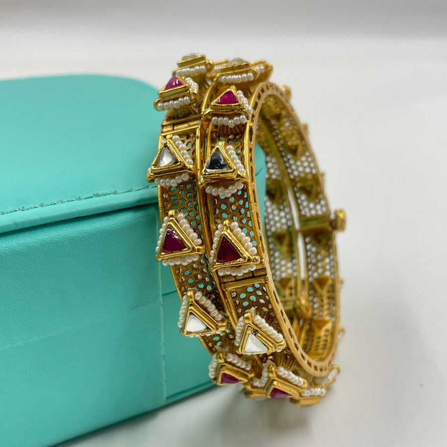 Handcrafted golden bangles that showcase unique artistry.