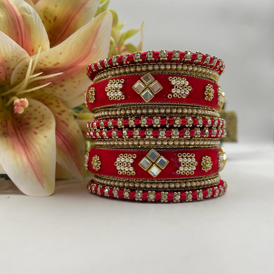 Bridal chuda set in vibrant colors, adorned with sparkling stones for a stunning look.