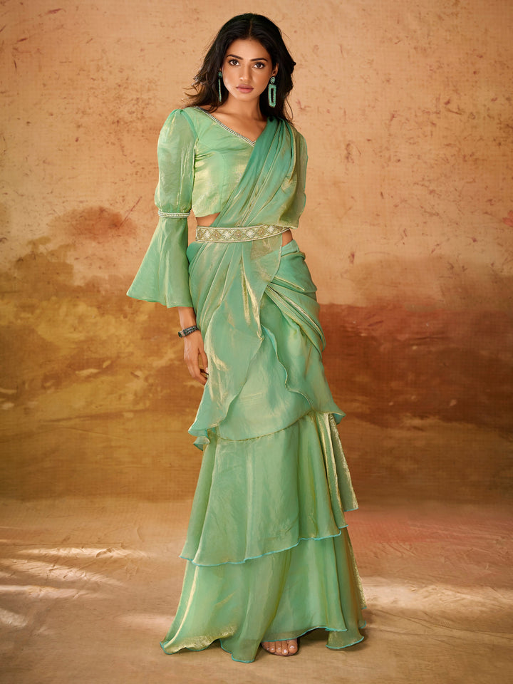 Green luxurious fabric saree crafted for elegance and style.