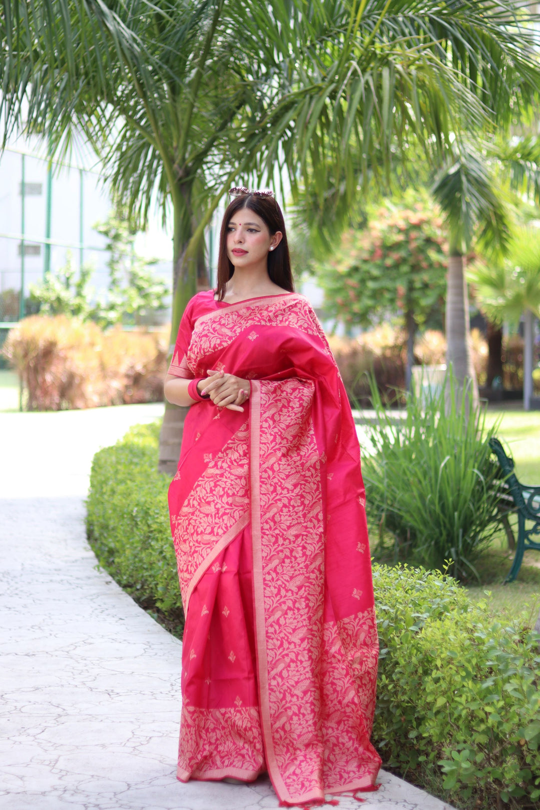 Traditional handloom raw silk saree with intricate weaving butties and pallu