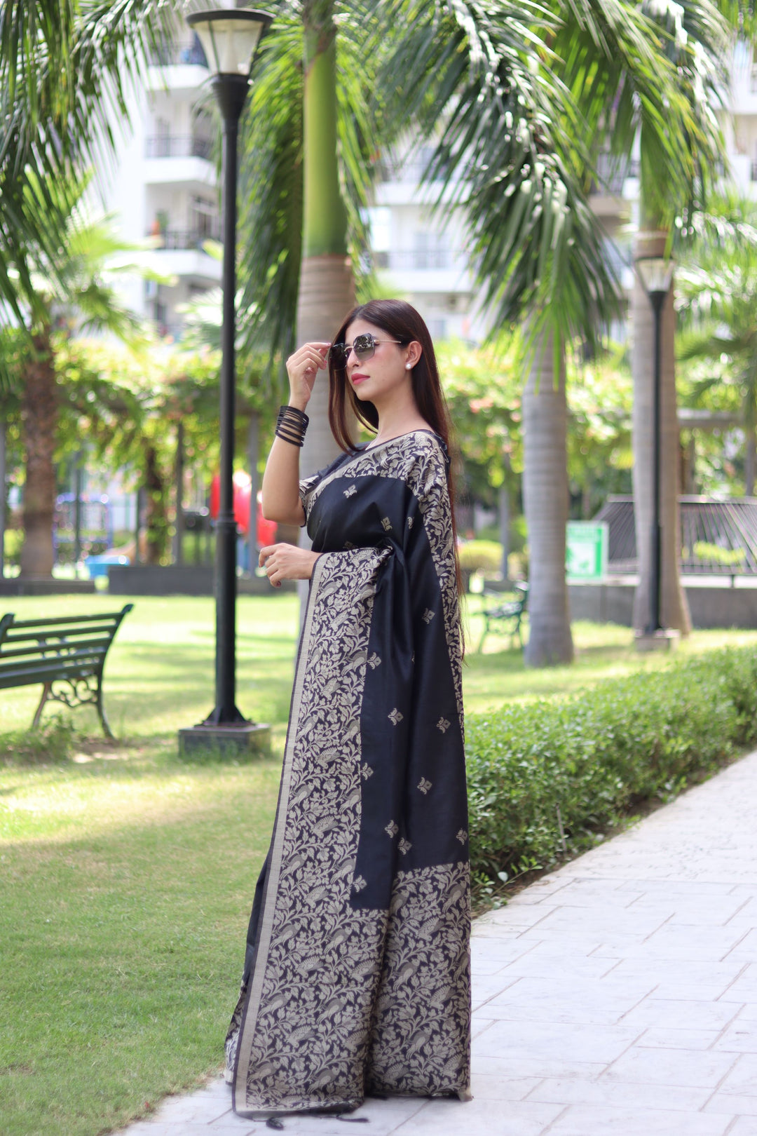 Traditional raw silk saree with woven pallu and intricate weaving butties