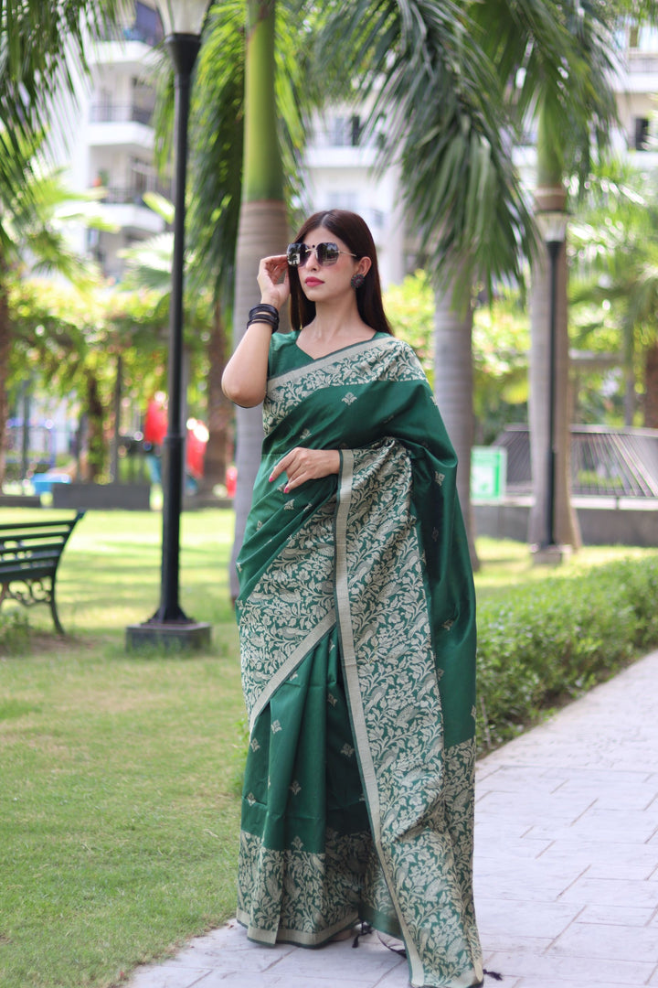 Timeless raw silk saree with woven pallu and intricate butties for celebrations