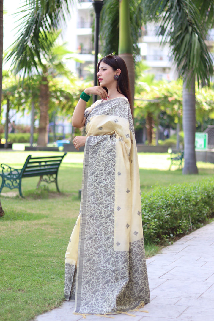 Handloom raw silk saree with detailed butties and woven pallu for special occasions