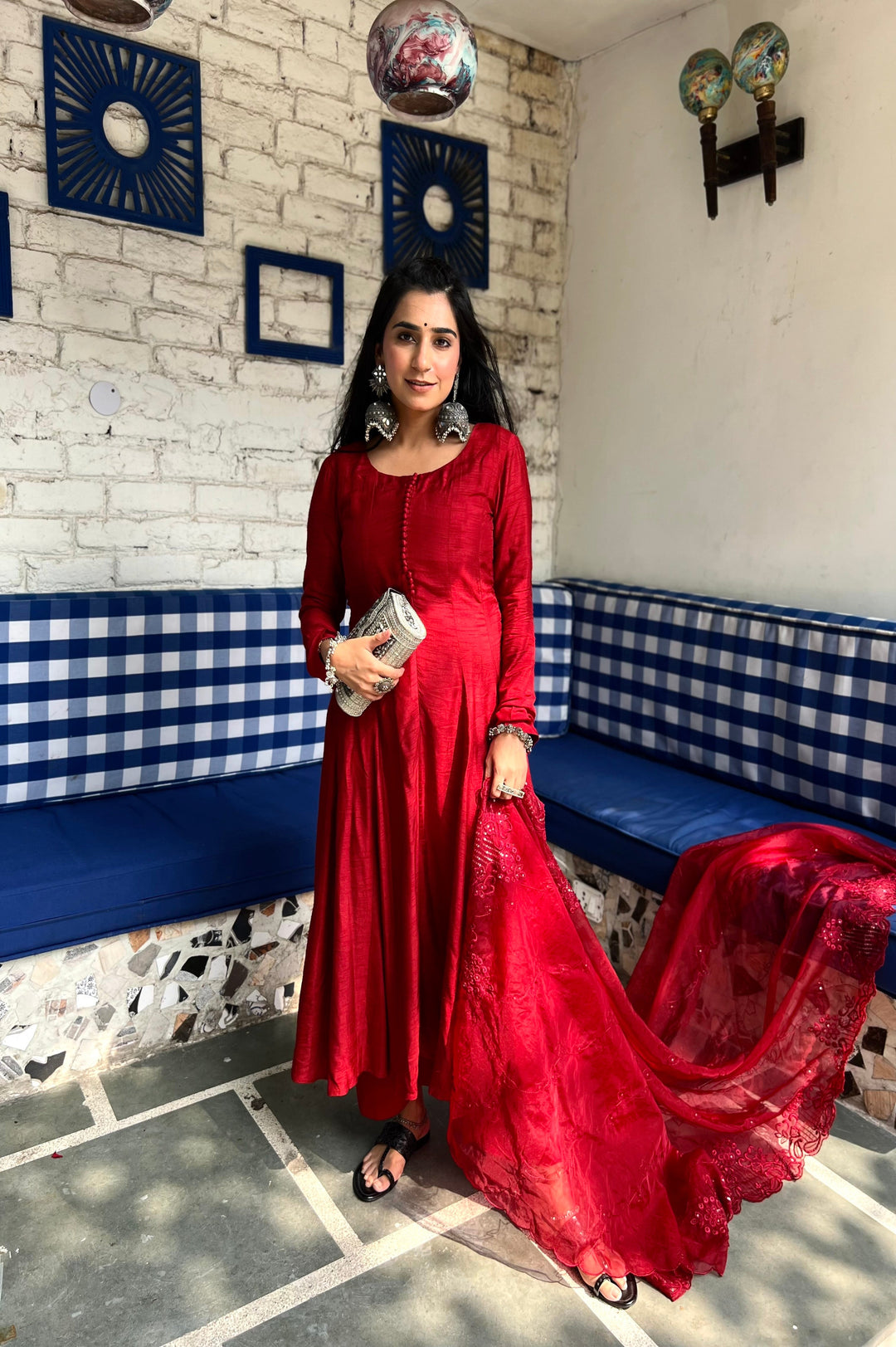 Sophisticated blood red Anarkali outfit ideal for festive occasions, featuring delicate embellishments and a flattering fit.