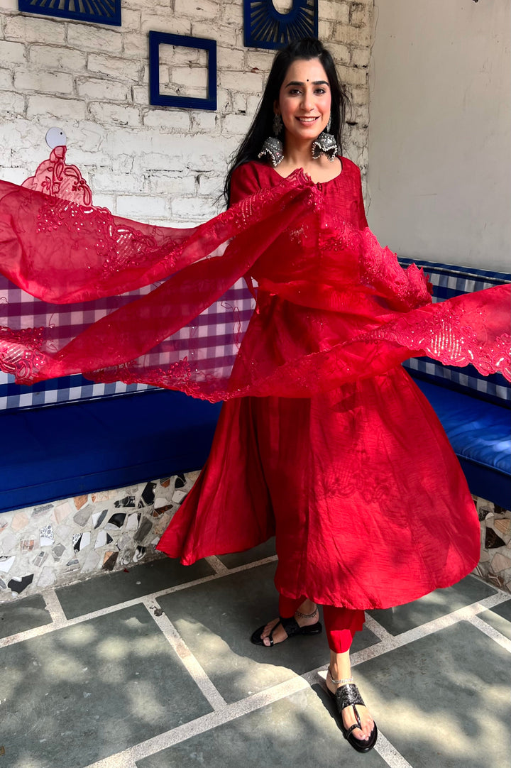 Chic blood red Anarkali suit set designed for an elegant look, featuring intricate embroidery and a flowing silhouette.