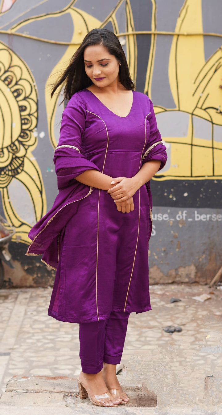 Purple silk top suit set paired with a delicate chanderi dupatta, showcasing elegance and modern design.