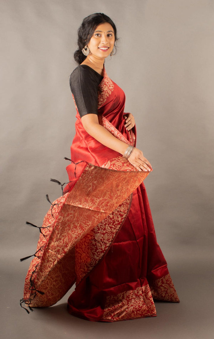 Timeless red handloom raw silk saree with a rich pallu, ideal for festive celebrations.