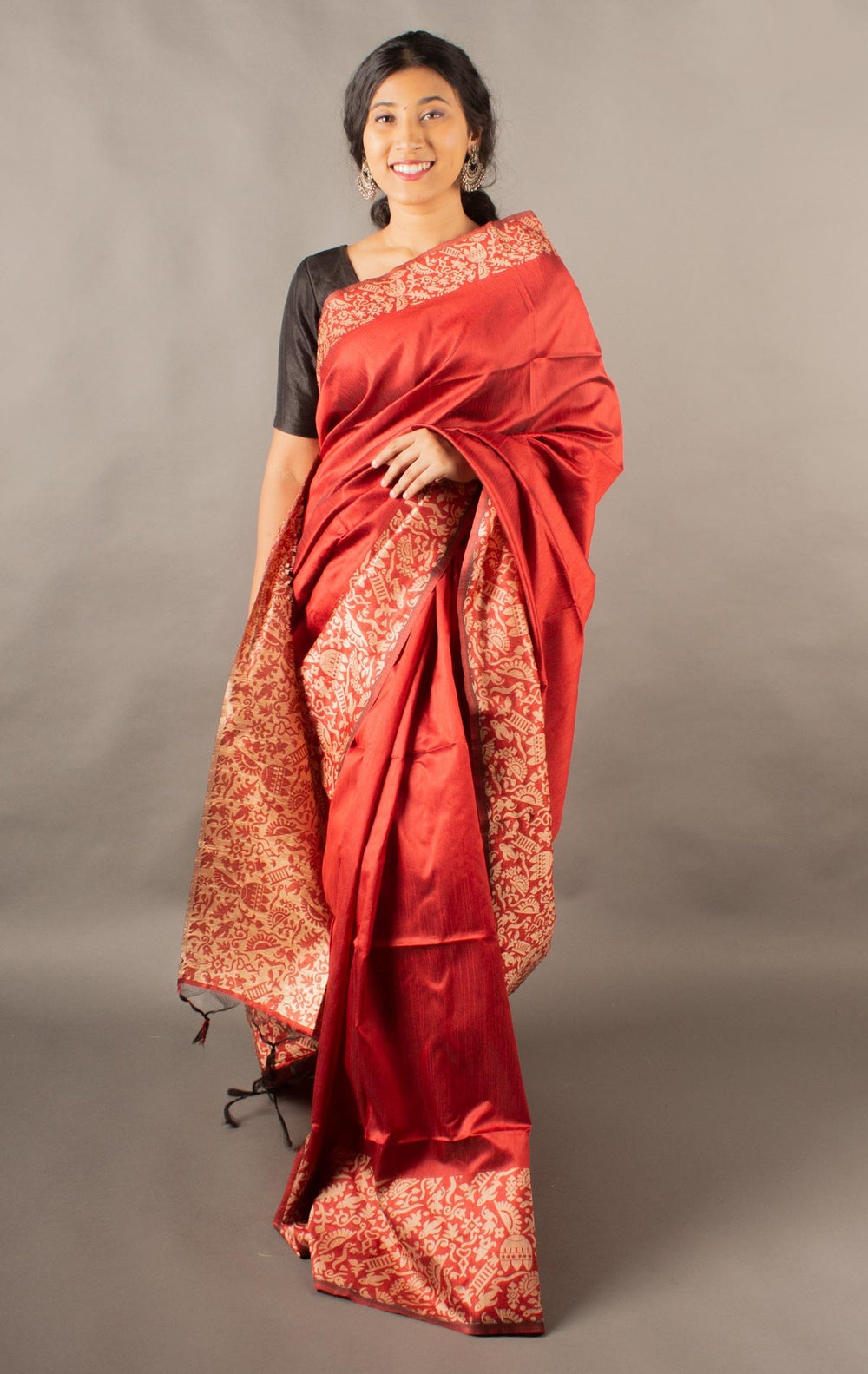 Traditional red raw silk saree with a rich pallu, perfect for grand Indian ceremonies.