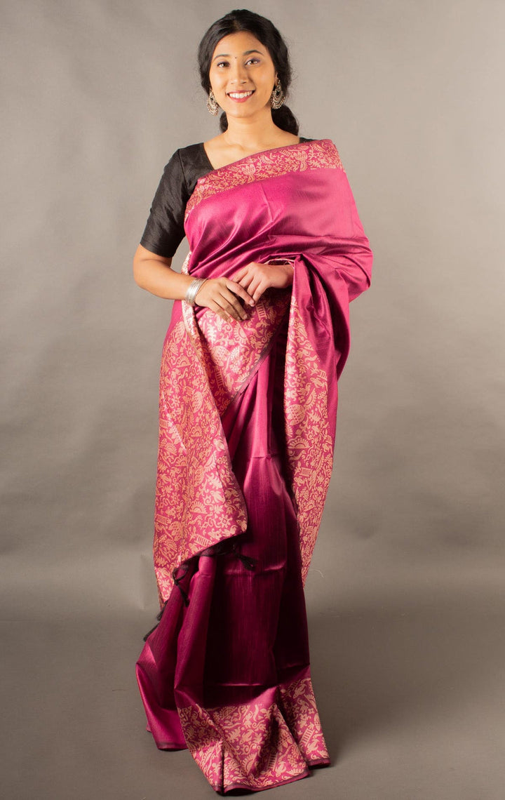 Vibrant bright pink handloom raw silk saree with rich pallu, ideal for cultural celebrations.