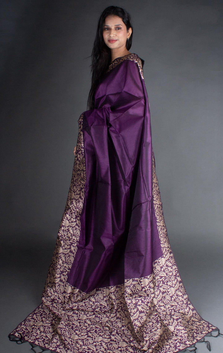 Purple raw silk saree with intricate pallu detailing, ideal for cultural celebrations.