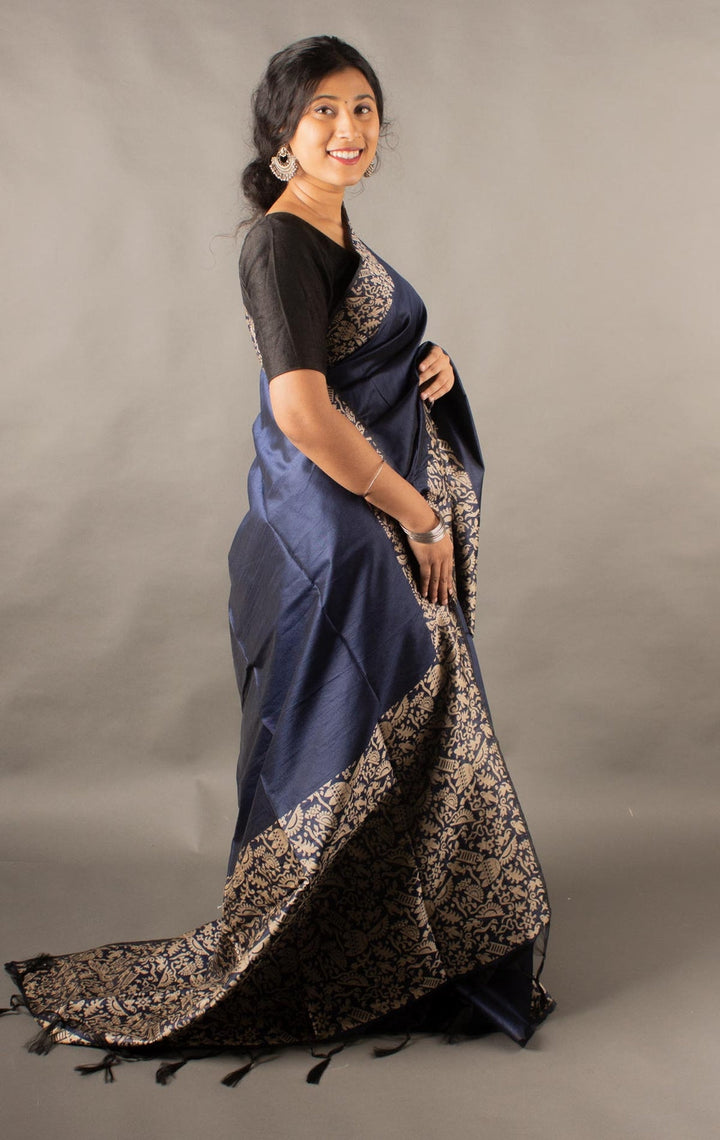 Sophisticated navy raw silk saree with a rich pallu, perfect for traditional Indian ceremonies.