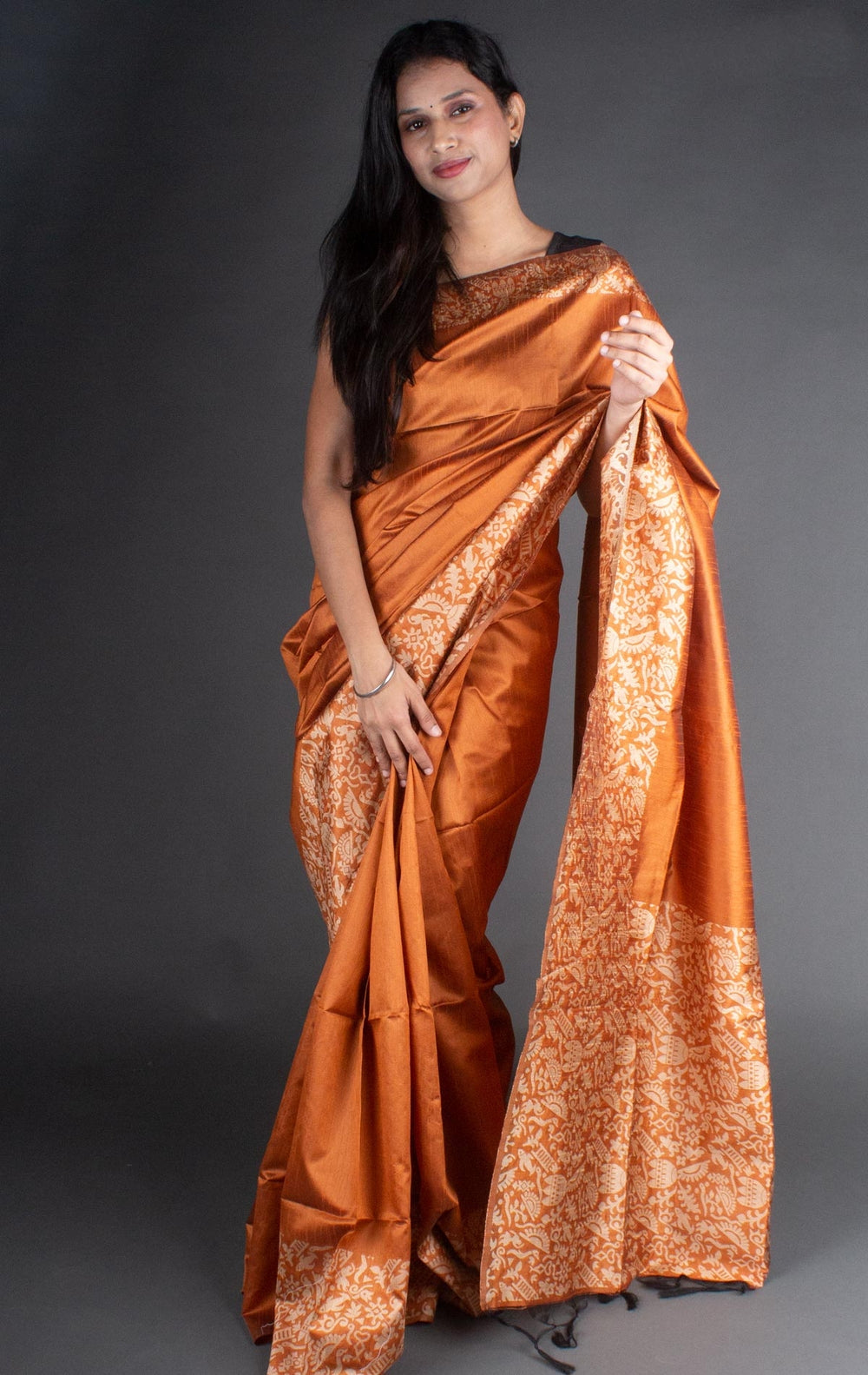 Vibrant orange Banglori handloom raw silk saree with a rich pallu, perfect for cultural celebrations.