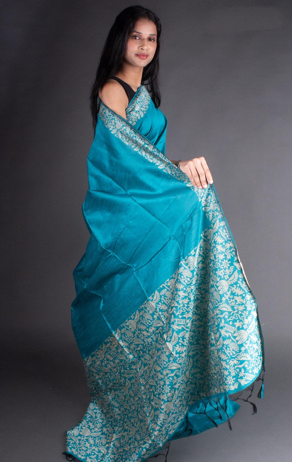 Exquisite sea blue raw silk saree with rich pallu detailing, ideal for Indian weddings.