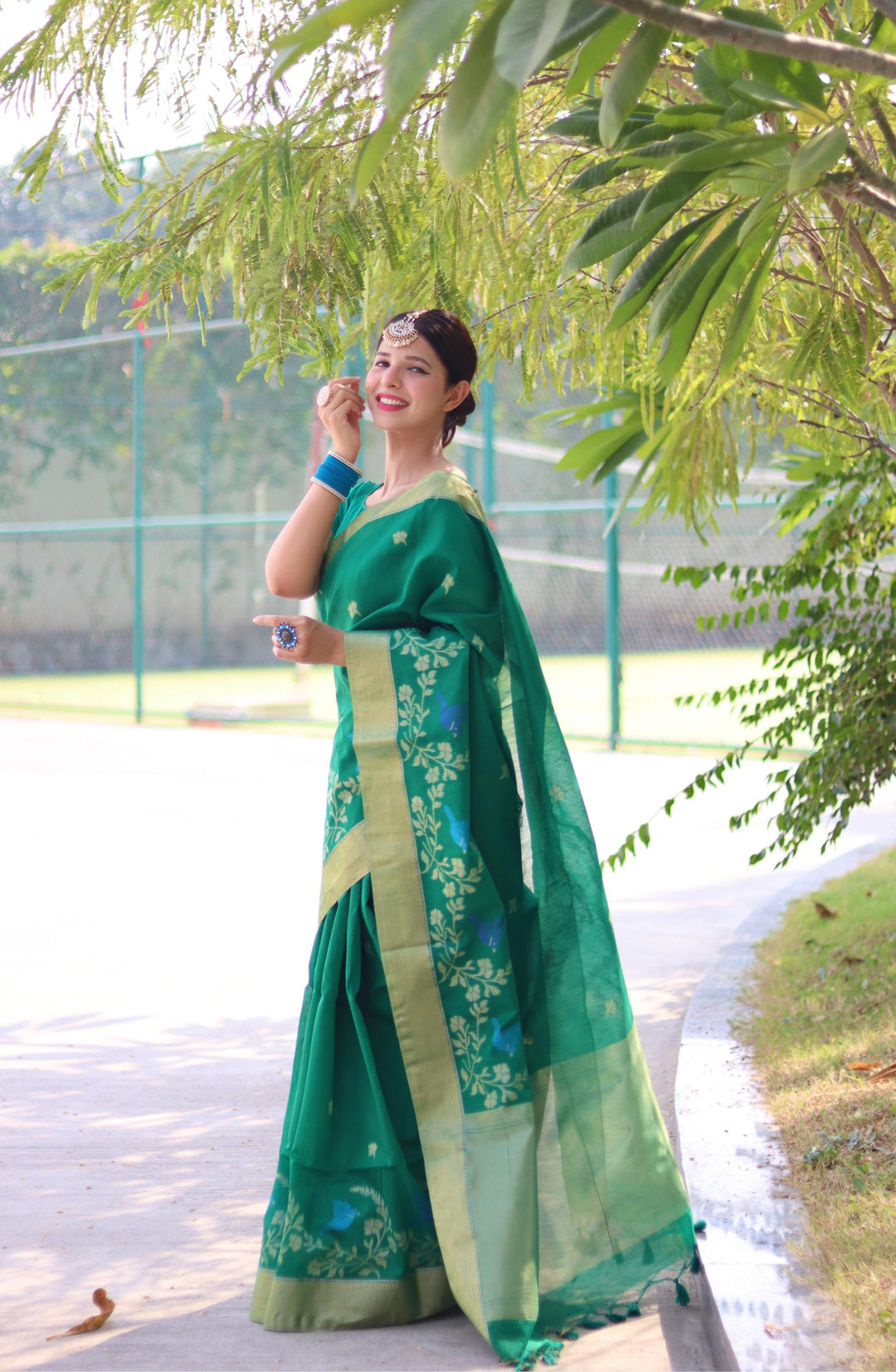 Festive linen silk saree with traditional Jamdani border and zari butti