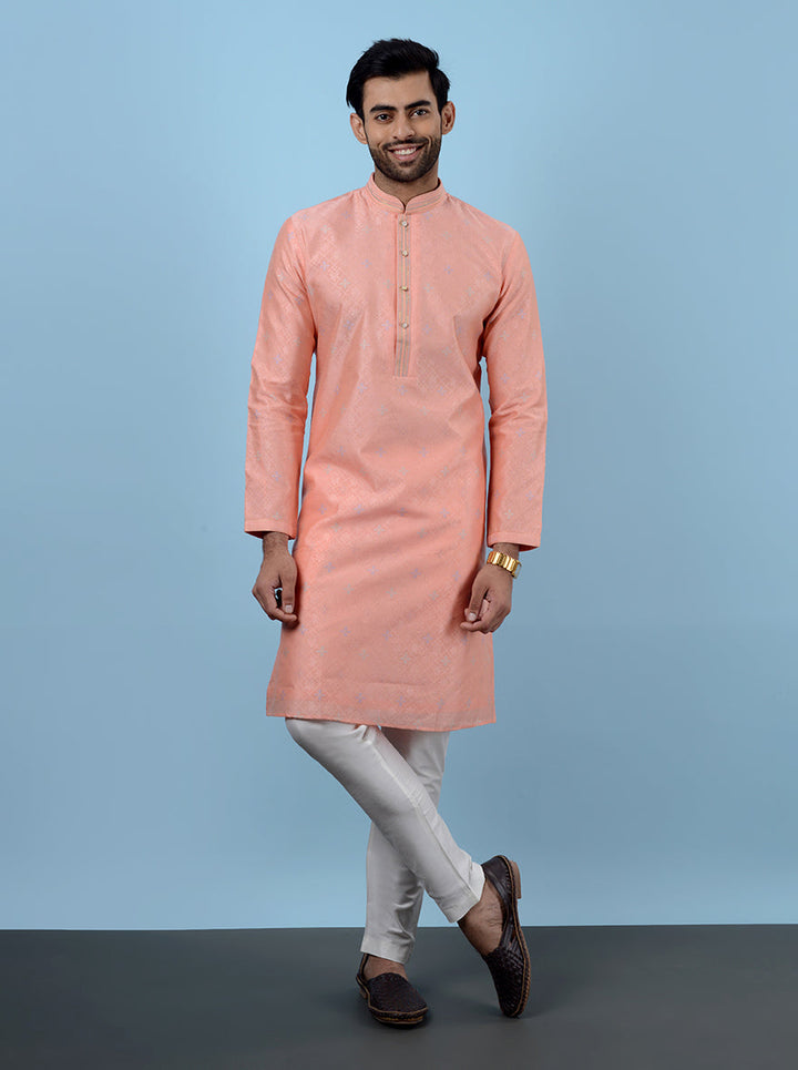 Step into style with this fashionable Peach Kurta Pajama for men.