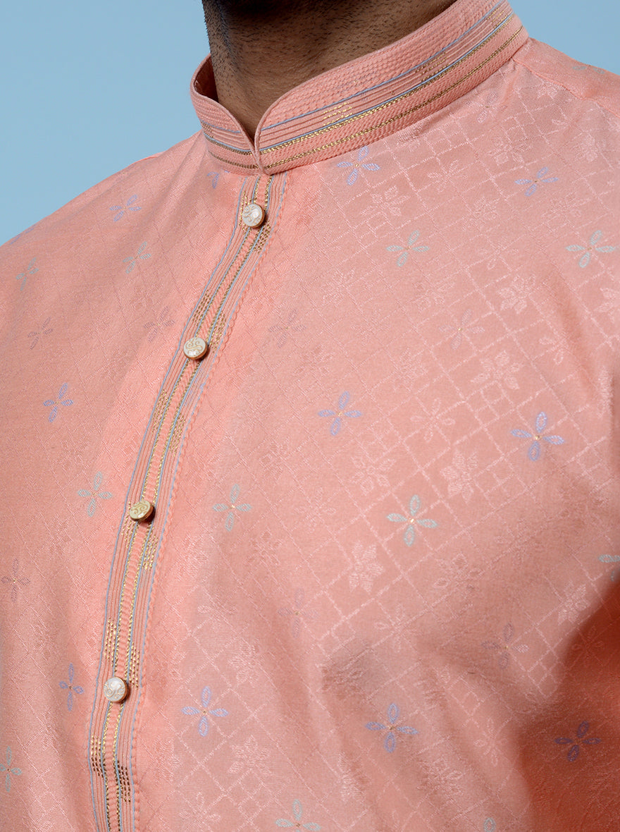 Ideal for celebrations, this Peach Kurta Pajama adds flair to your look.