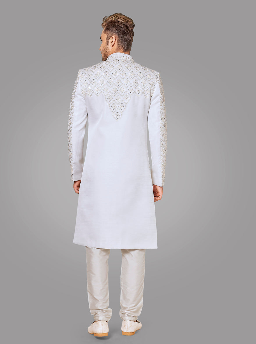 Elevate your wedding attire with this intricately designed off-white silk sherwani, tailored for sophistication.