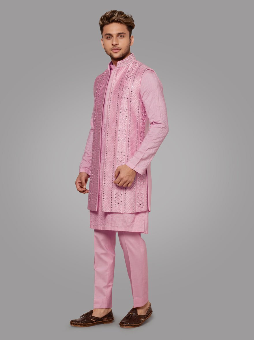 The unique jacket adds charm to this beautifully embroidered pink kurta, ideal for special occasions.