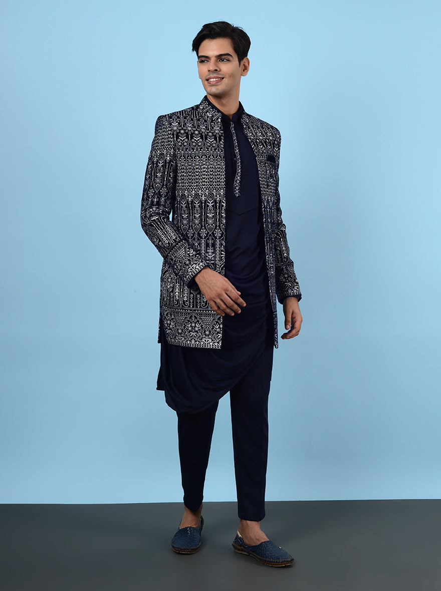 Impress at your sangeet and reception in this chic navy blue Indowestern, featuring premium velvet and exquisite embroidery, tailored for stylish men in the USA.