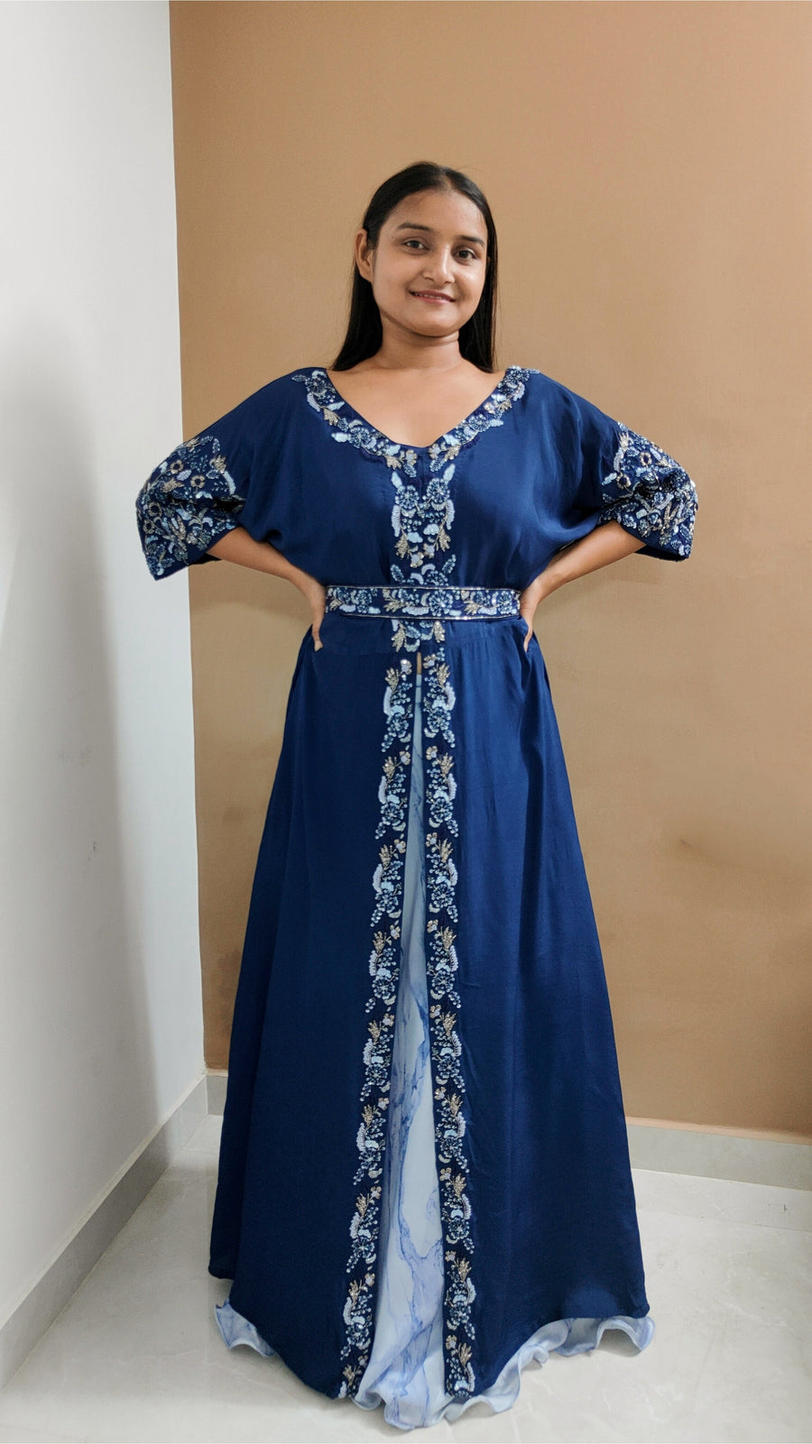 Elegant royal blue jacket paired with a sky blue lehenga set, featuring embroidered belt and intricate khat work for style.