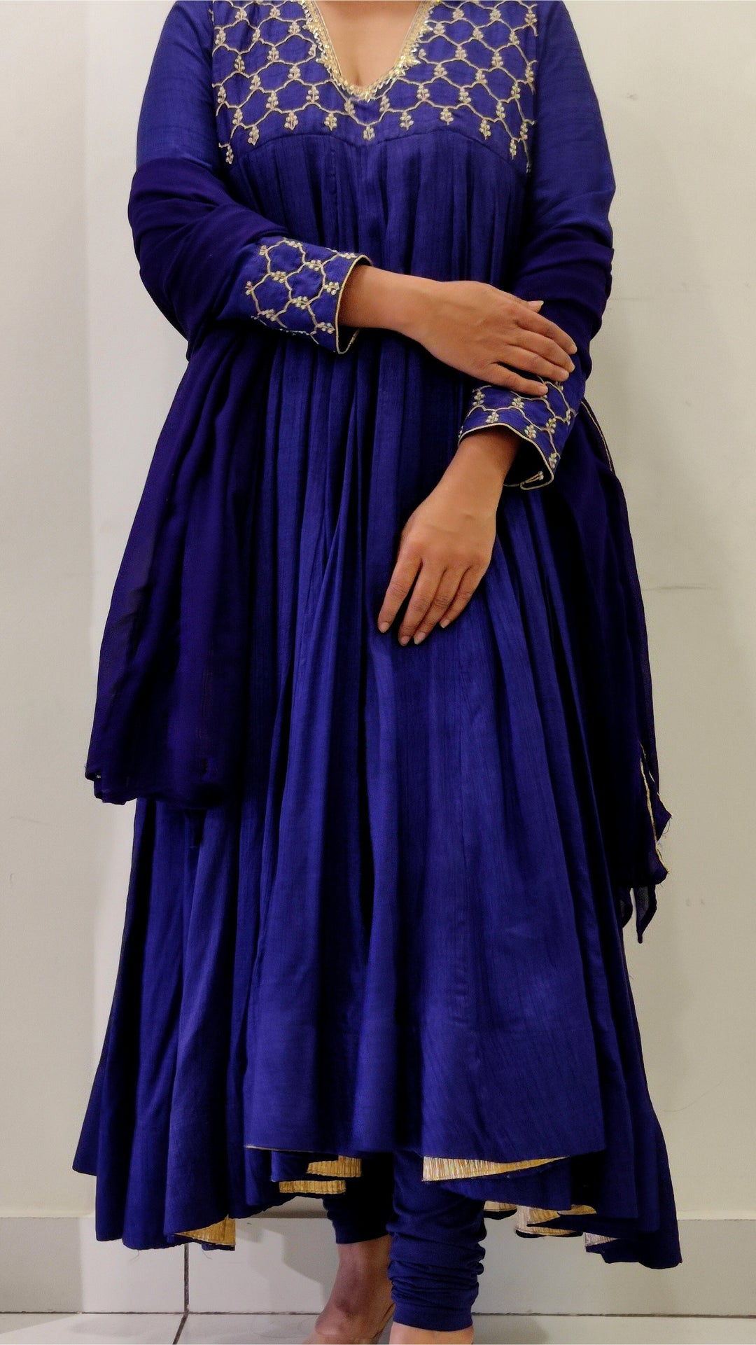 Chic royal blue Anarkali in Tussar silk with exquisite Aari detailing, complemented by a flowing dupatta.