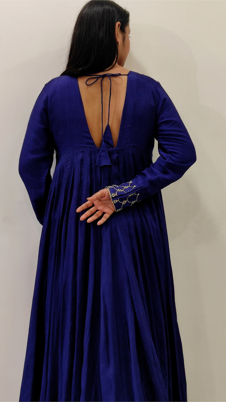 Beautiful royal blue Morni Anarkali gown made from Tussar silk, featuring elegant Aari work and a dupatta.