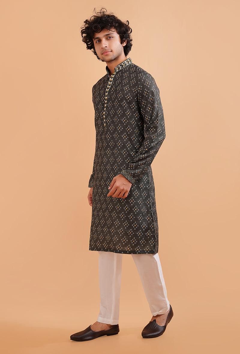 Men’s dark green kurta pajama set with intricate embroidery, ideal for festive and cultural wear.