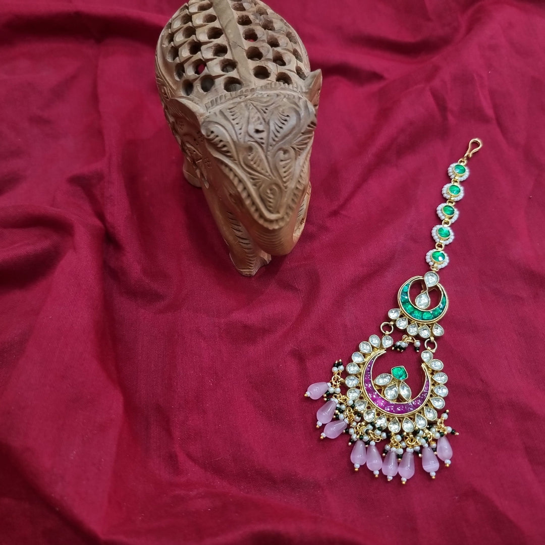 Designer bridal mang tika, an essential accessory for a complete wedding look.