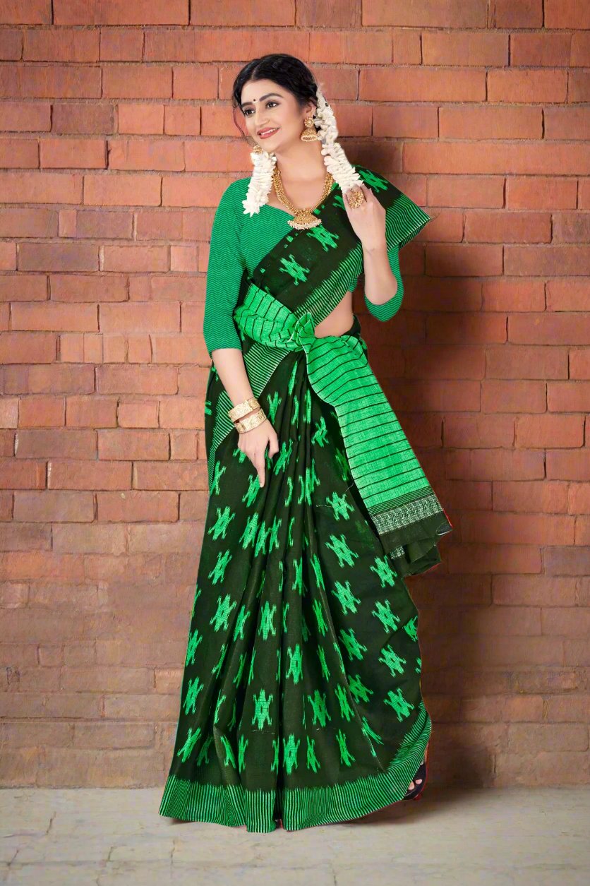 Stunning dark green batik saree, perfect for special events and cultural celebrations.