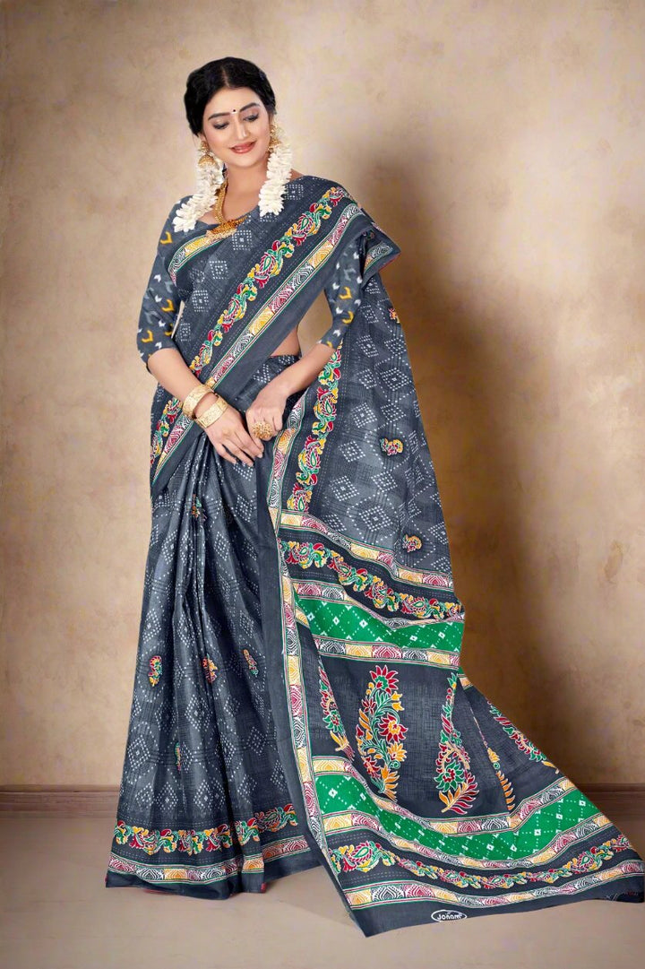 Gorgeous grey saree with batik art, crafted from soft cotton, perfect for wedding celebrations.