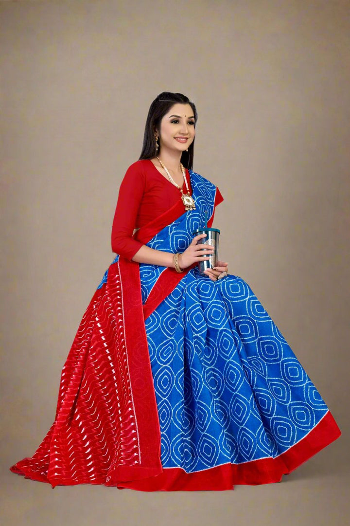 Stylish blue and red saree with batik patterns, ideal for traditional wedding events.