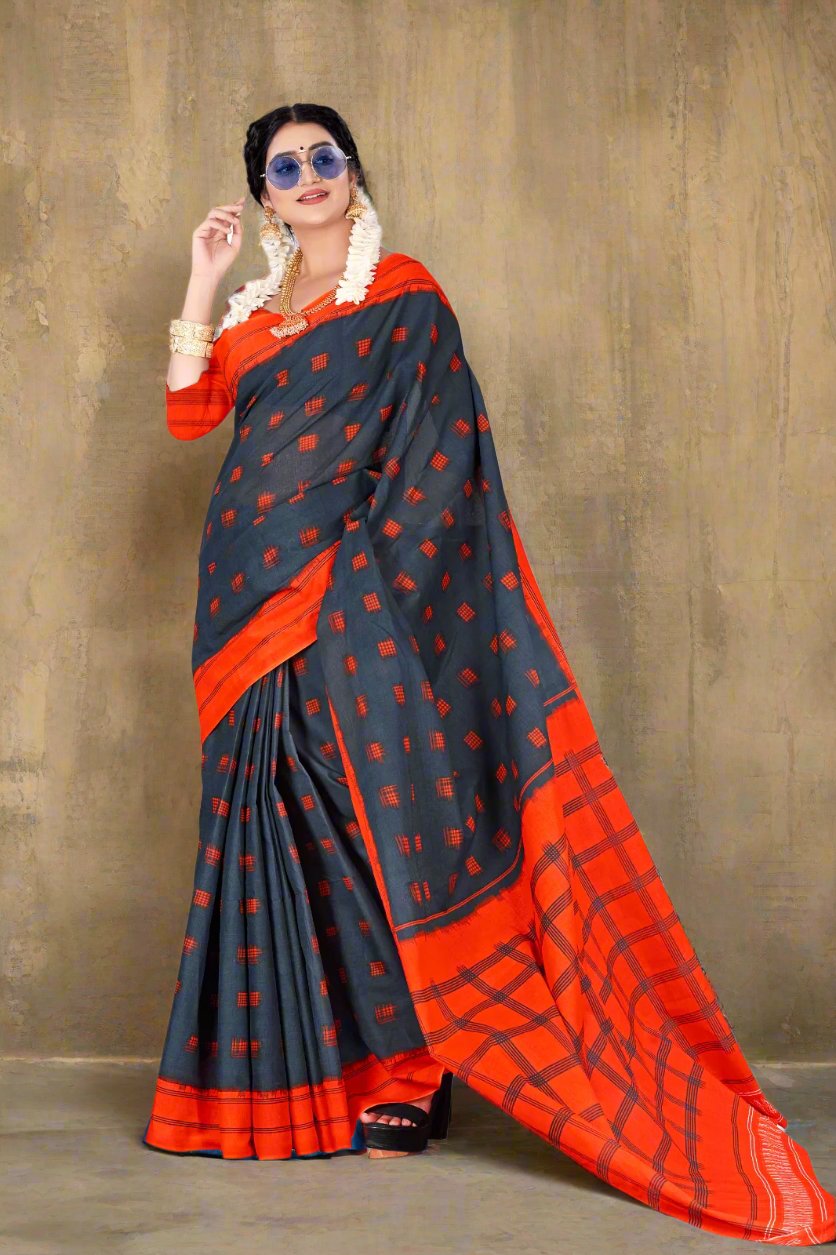 Gorgeous gray and orange saree, crafted from handloom cotton with intricate batik patterns.