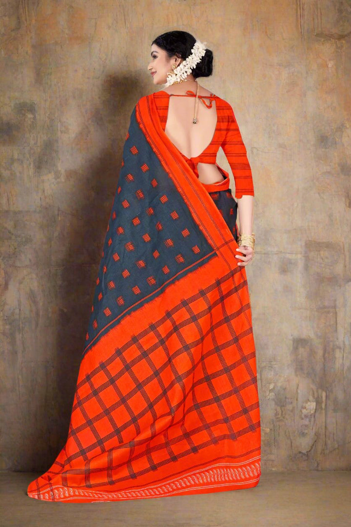 Beautiful gray and orange saree with batik print, ideal for traditional and festive occasions.