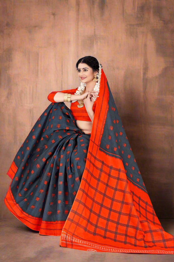 Vibrant gray and orange batik saree, ideal for Indian cultural festivals and ceremonies.