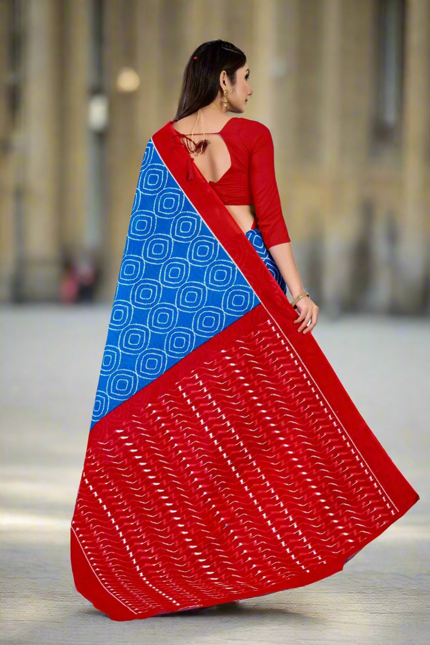 Elegant blue and red batik saree, crafted from cotton, perfect for festive celebrations.