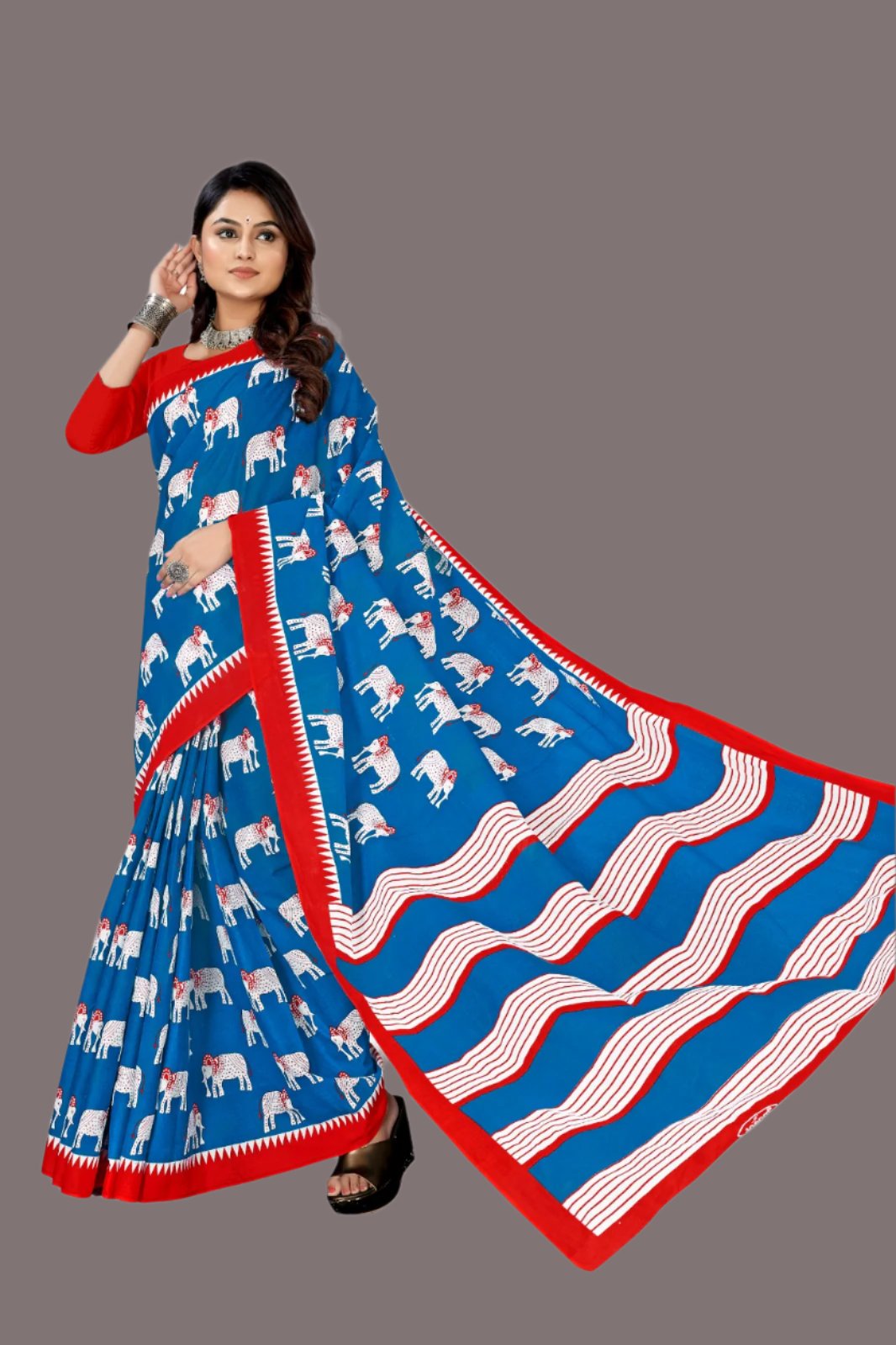 Gorgeous blue and red saree with batik designs, perfect for festive and cultural events.