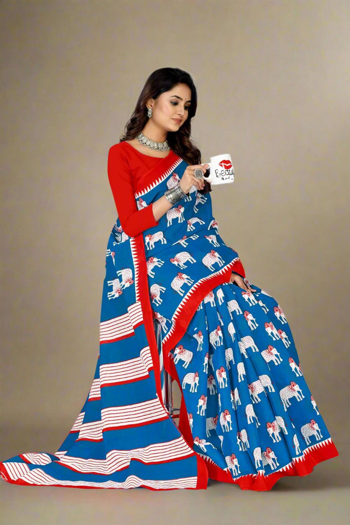 Stylish blue and red saree with traditional batik print, ideal for Indian weddings and events.