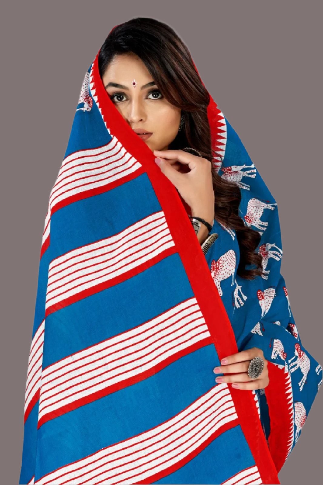 Bold blue and red batik print saree, a stunning choice for traditional Indian celebrations.