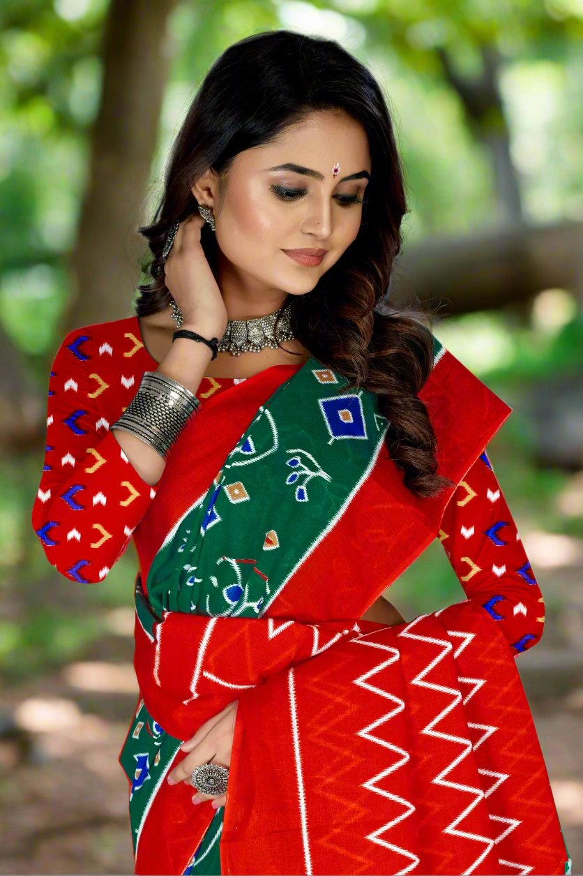 Green and red batik cotton saree, an elegant choice for cultural and traditional celebrations.