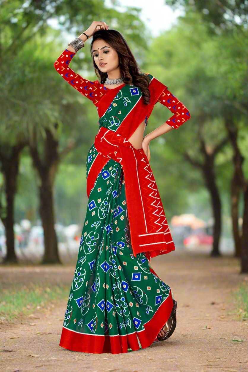 Stunning green and red batik print cotton saree, ideal for cultural gatherings and celebrations.