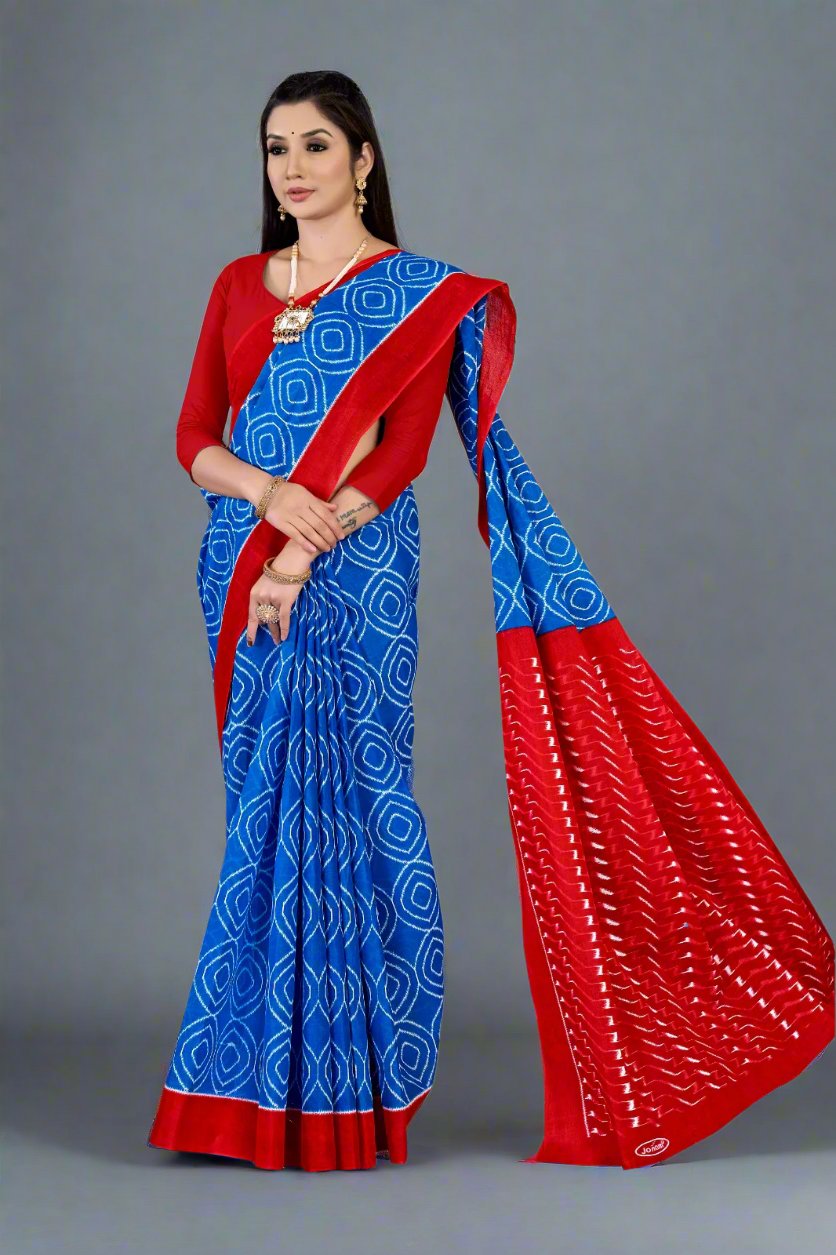 Designer blue and red batik cotton saree, a stunning choice for festive occasions.