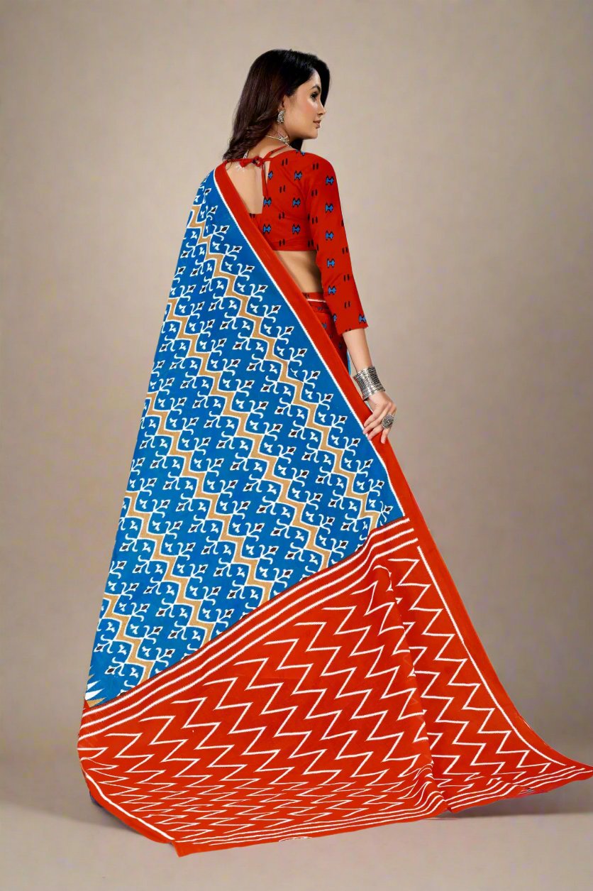 Stunning blue and orange batik print saree, ideal for weddings and special occasions.