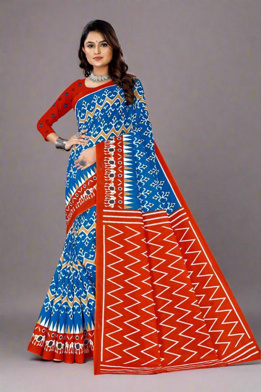 Vibrant blue and orange batik cotton saree, perfect for festive celebrations and cultural events.