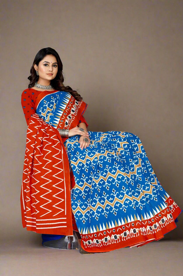 Elegant blue and orange batik cotton saree, ideal for Indian festivals and special events.