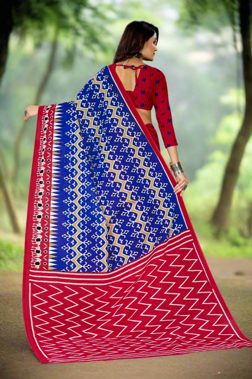 Designer blue and burgundy batik cotton saree with intricate patterns, ideal for weddings and celebrations.